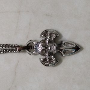 Chisel stainless steel skull pendant and chain necklace.